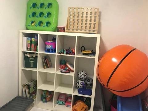 store cupboard with toys